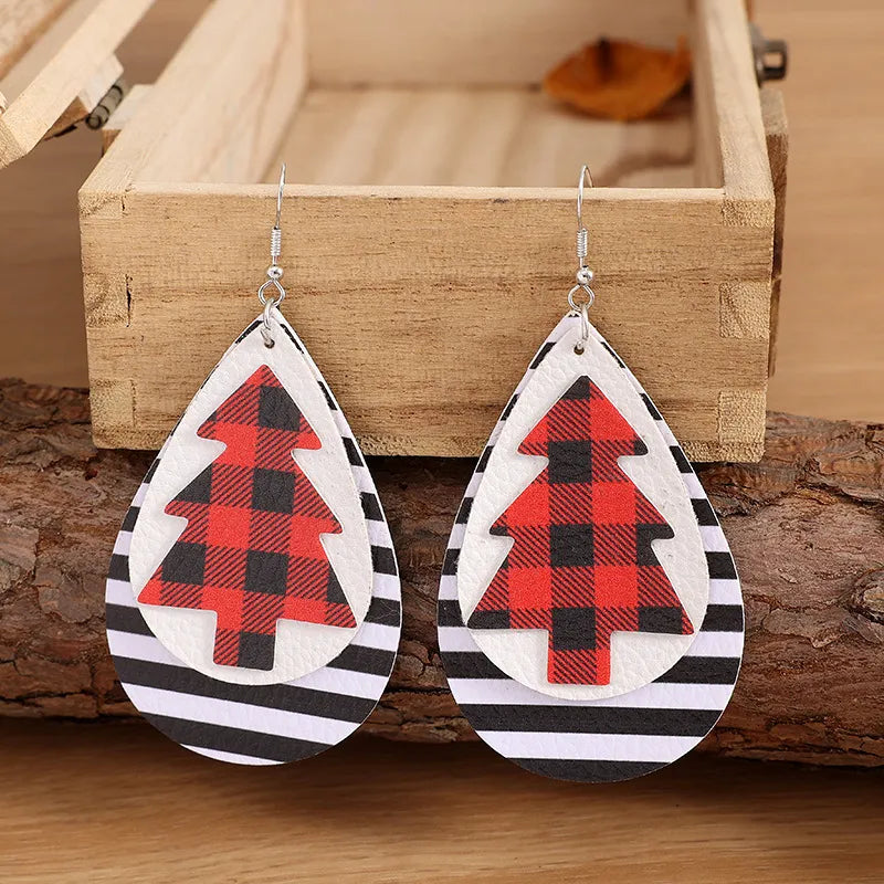 Plaid tree teardrop earrings with black and white stripes.