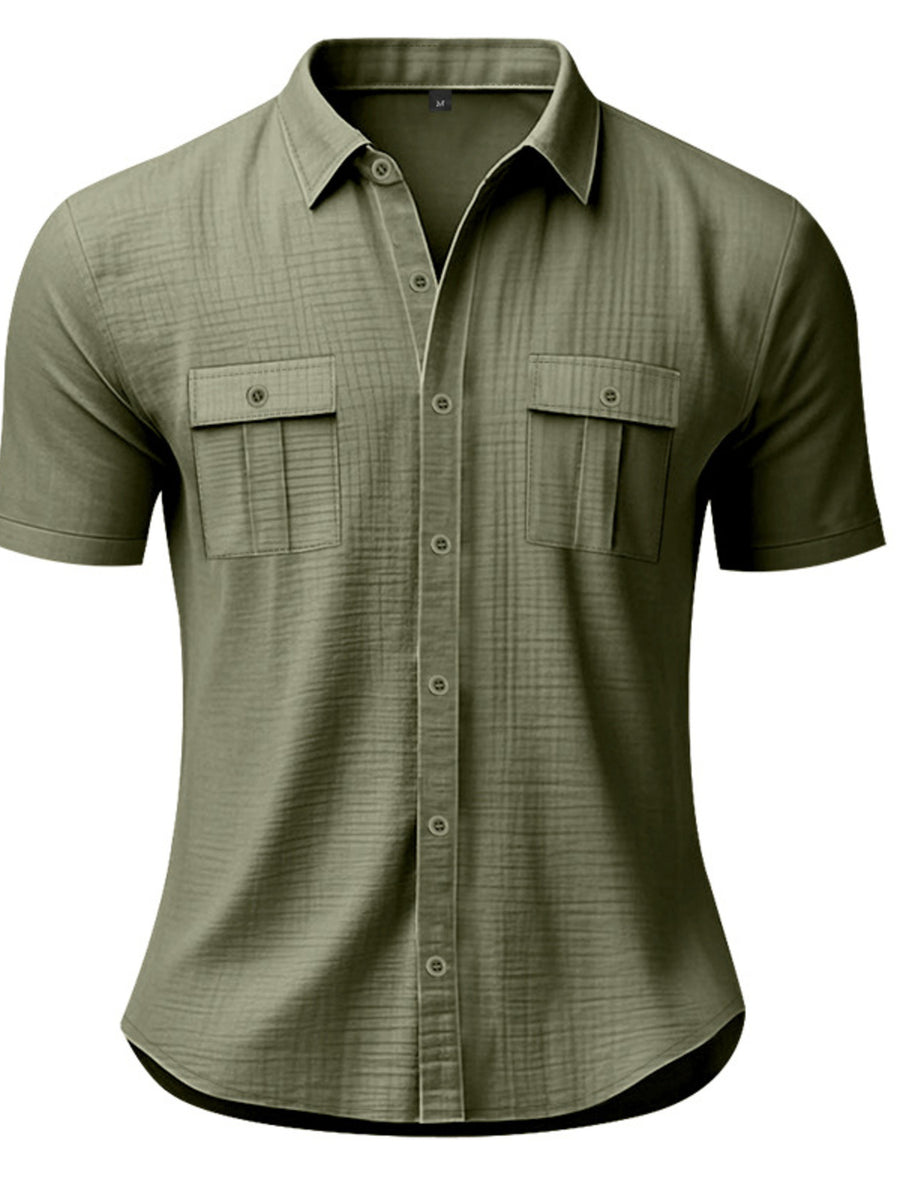 Military green short sleeve button-down shirt with two chest pockets and subtle texture.