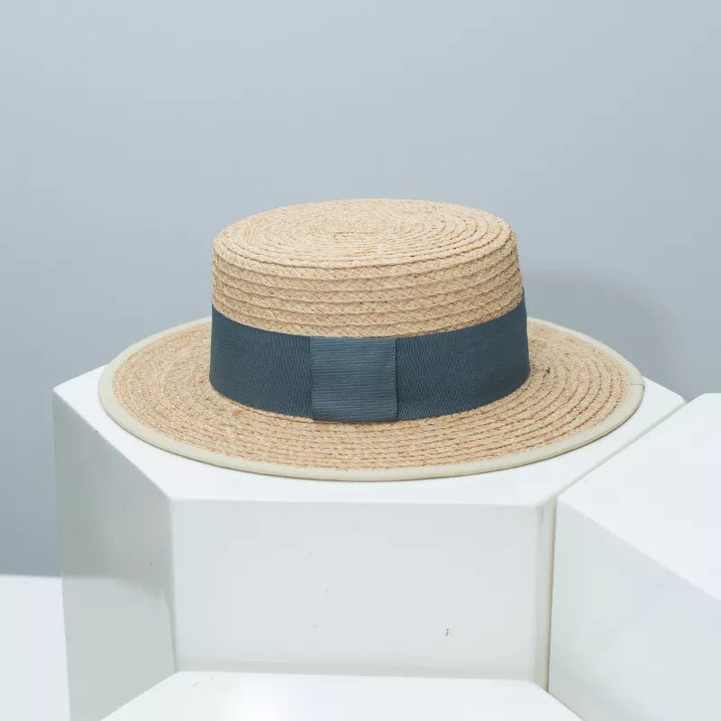 Classic straw boater hat with a grey band and cream trim