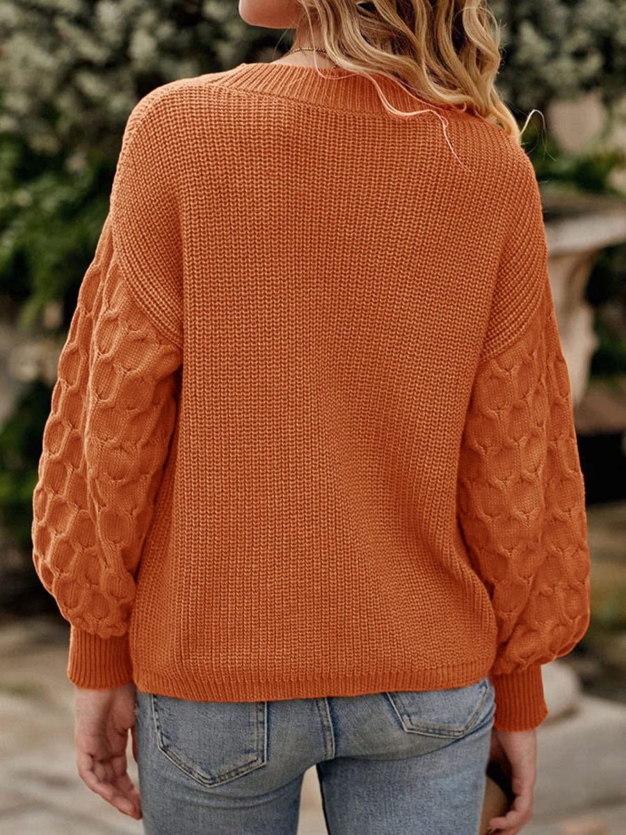 Terracotta pullover sweater featuring ribbed knit and textured