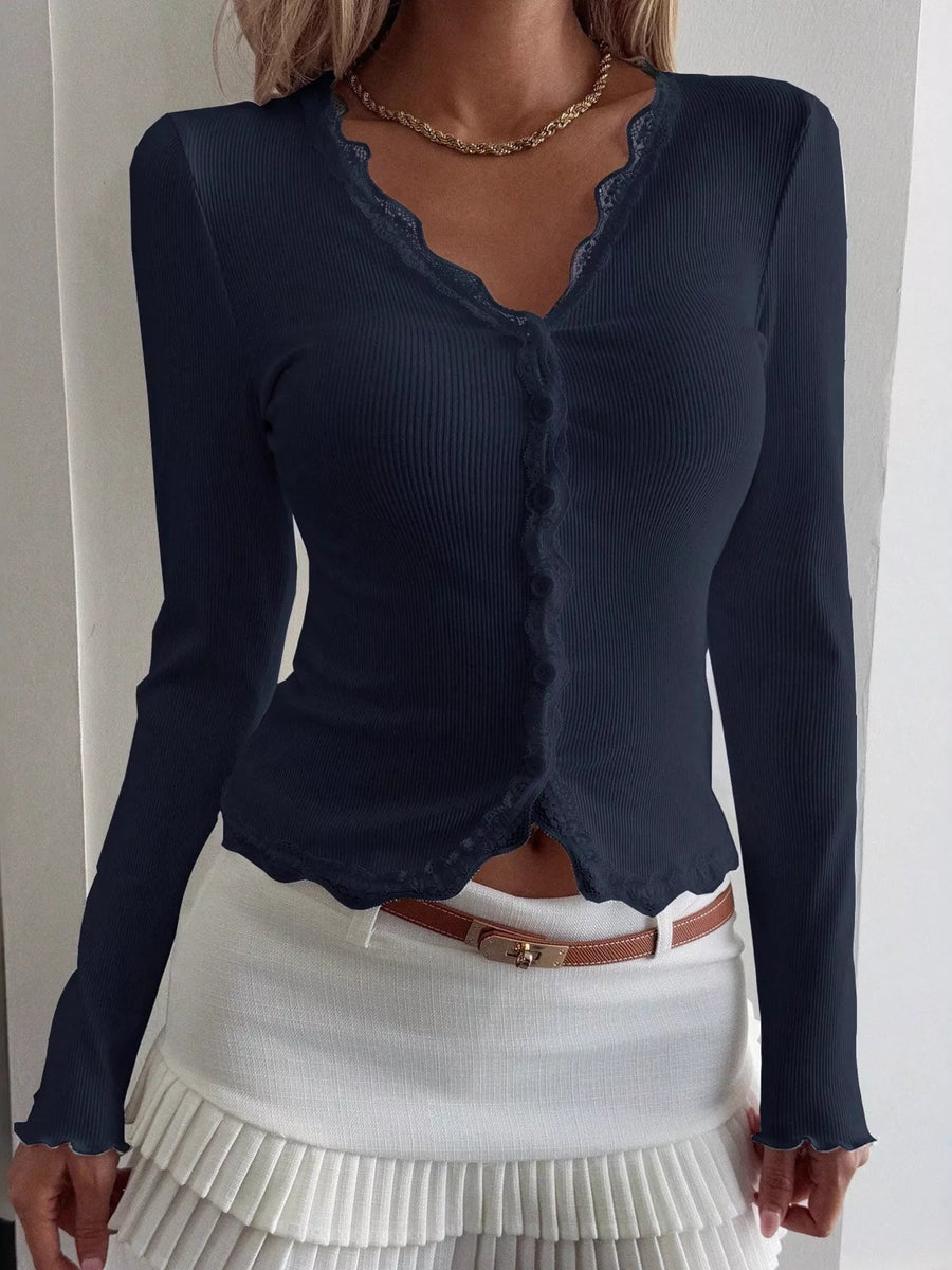 Navy ribbed long sleeve top with button front and lace trim neckline and hem.