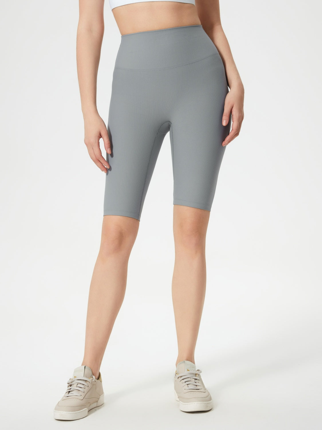 Gray ribbed contour cycling shorts with a high waist and mid-thigh length.