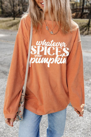 Textured graphic crewneck pullover in sherbet orange with white "whatever spices your pumpkin" graphic.