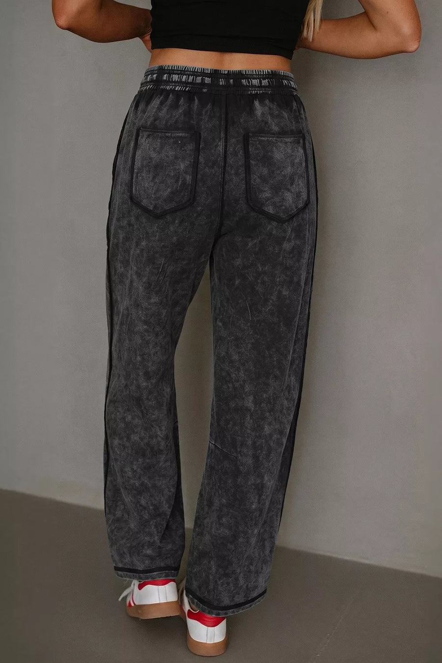 80% cotton, 20% polyester Care instructions: Machine wash cold barrel pants in Black with relaxed silhouette