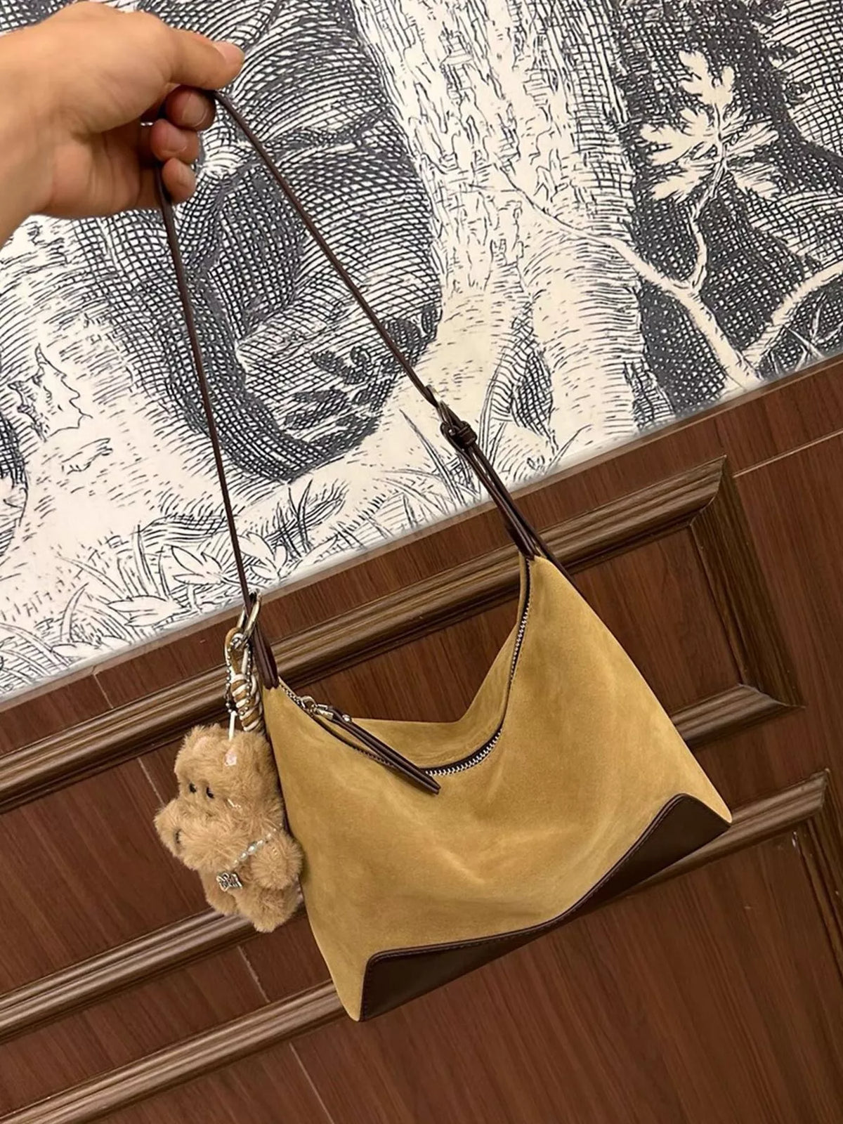 Taupe suede shoulder bag with adjustable strap and teddy bear charm