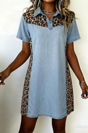 Denim shift dress with leopard print panels, short sleeves, and collar.