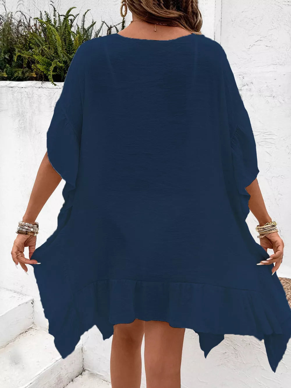 Indigo crochet trim cover-up dress with ruffled hem and short sleeves.