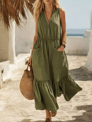 Army green sleeveless maxi dress with ruffled hem, V-neck, zip front, elastic waist, and pockets.