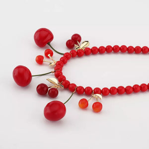 necklace in Red with cherry motif and beaded