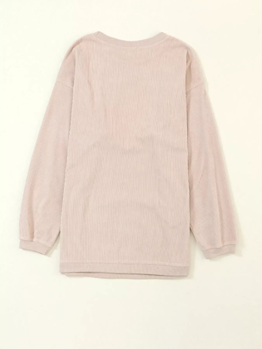 Eggshell corded sweatshirt with long sleeves and crewneck.