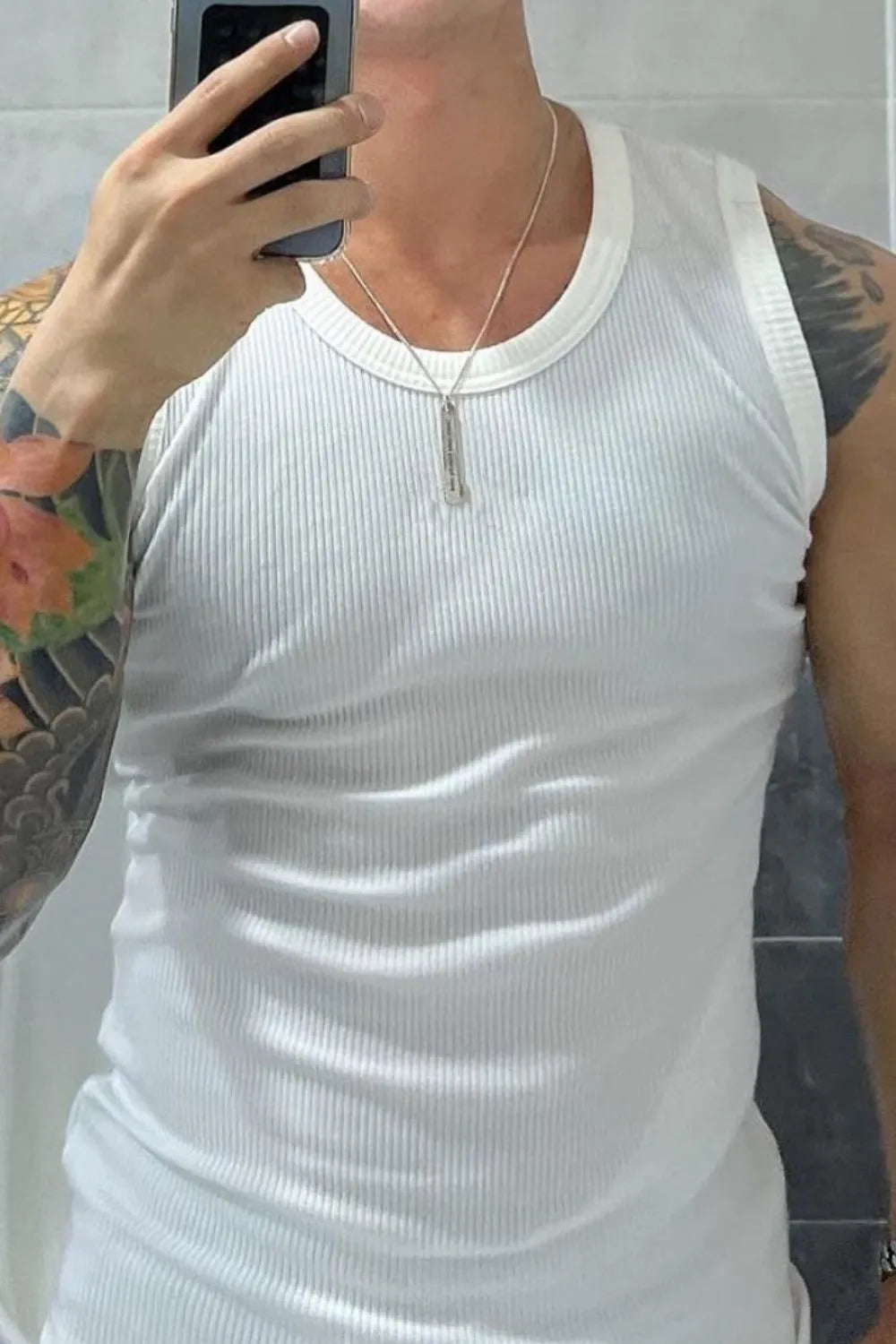 White ribbed cotton muscle tank top with a crew neck.
