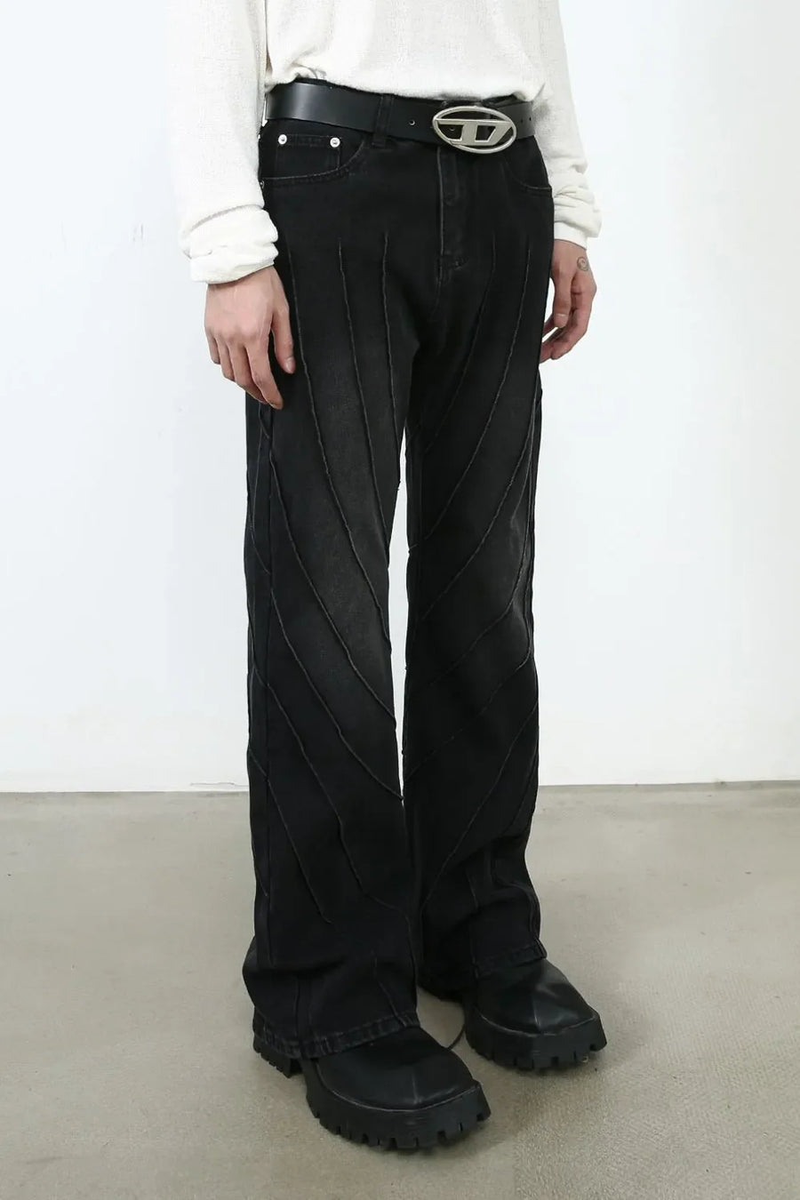 Dark denim flare trousers with chevron seam detail and wide leg