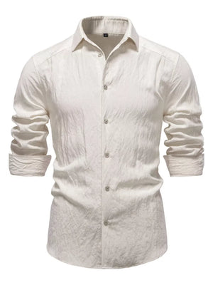 Elevated long sleeve button-up shirt in apricot with classic collar and textured cotton fabric.