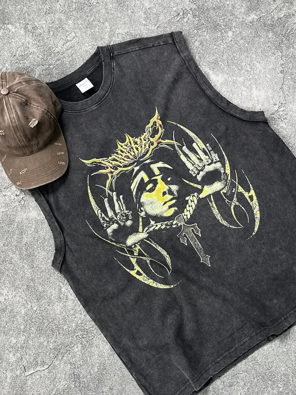 Black vintage wash graphic tank top with a distressed look and bold yellow graphic.