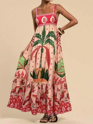 Tropical maxi dress in tan with square neck, palm trees, birds, and tiered hem.