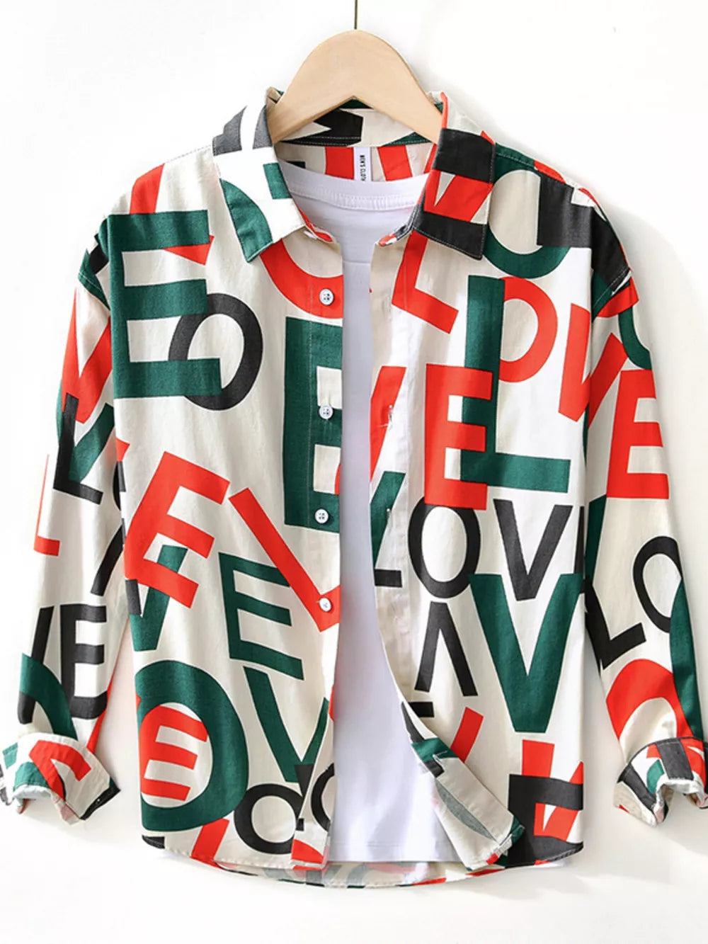 Men's long sleeve cotton shirt with all-over bold letter print in red, green, and black.