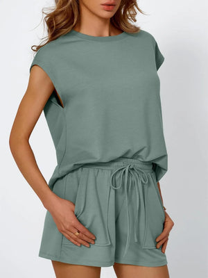 Relaxed fit drawstring short set in sage green with cap sleeves and elastic waist shorts.