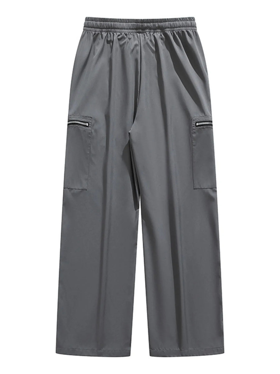 Plus-size dark gray cargo pants with drawstring waist and zippered pockets.