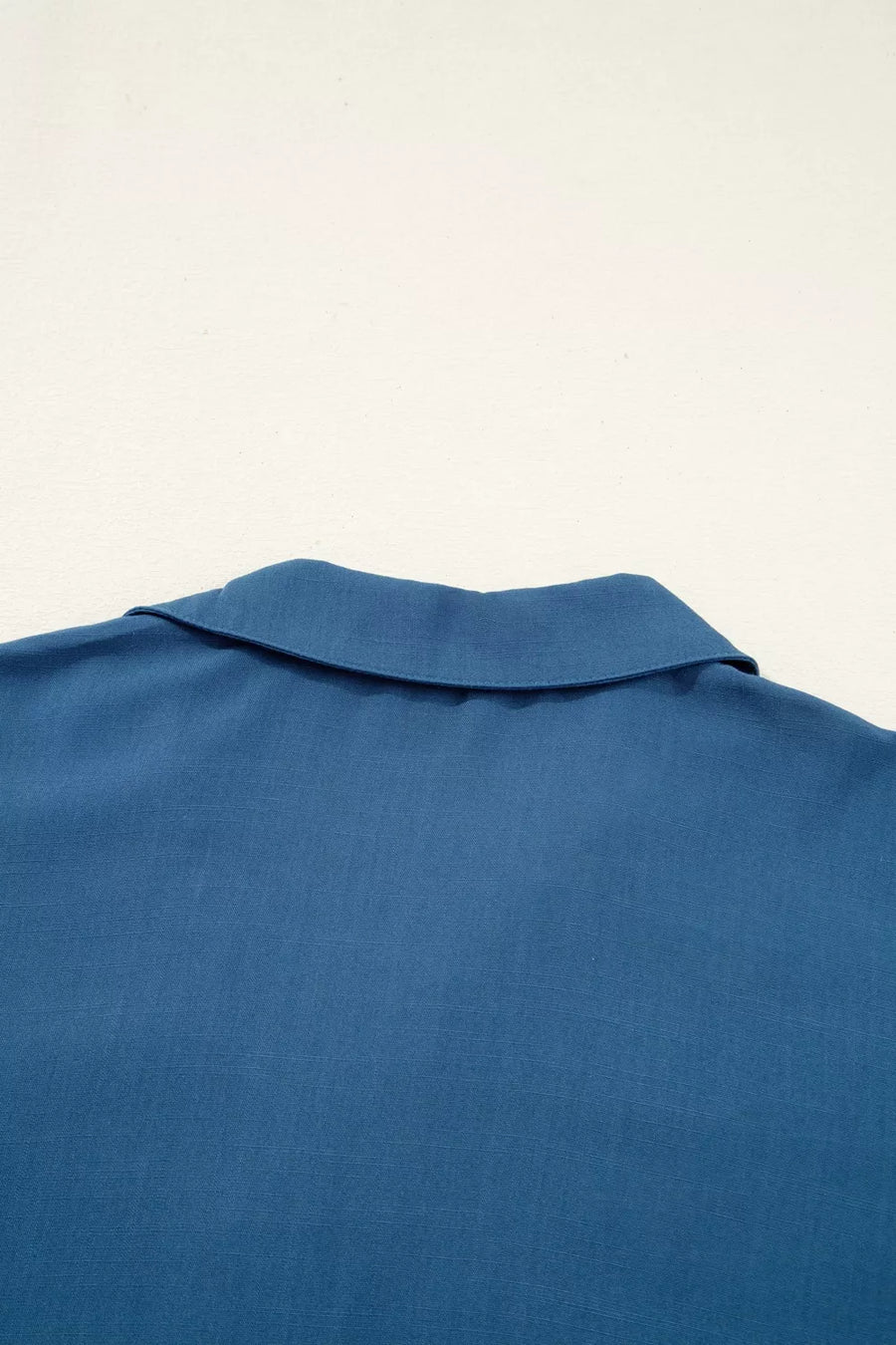 Blue linen blend shirt with a classic collar and short sleeves