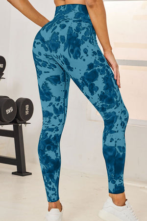 Turquoise ink blot high-waist sculpt leggings with a full-length cut.