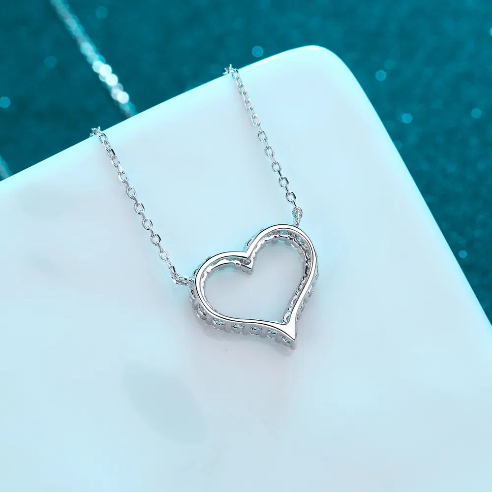 Silver open heart moissanite pavé pendant necklace with delicate chain.