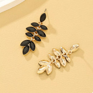 gold earrings featuring drop design and floral
