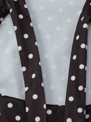 Chic brown and white polka dot mini dress with cut-out detail