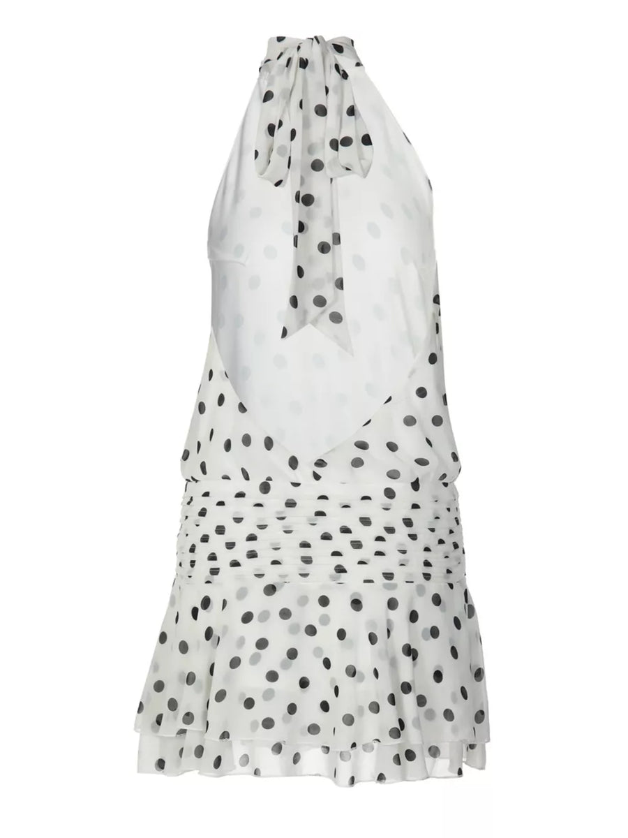 White polka dot halter neck mini dress with ruched waist and tie detail.