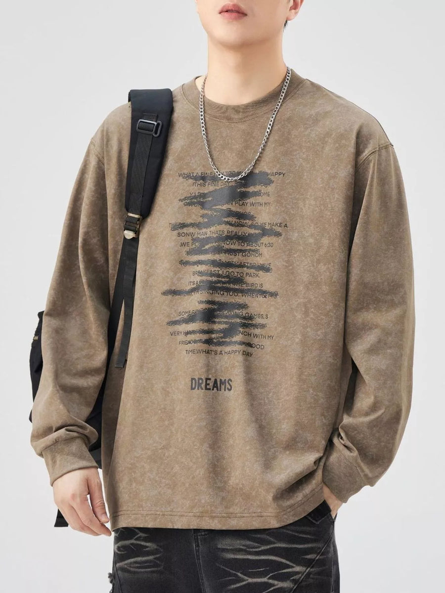 Brown oversized long-sleeve tee with graphic text print and "DREAMS" graphic.