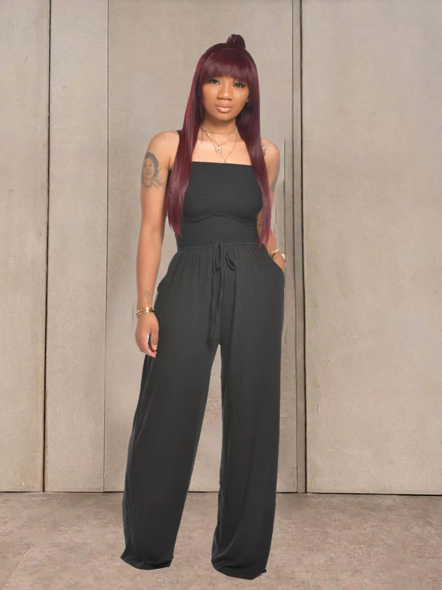 Black strapless smocked wide-leg jumpsuit with drawstring waist and pockets