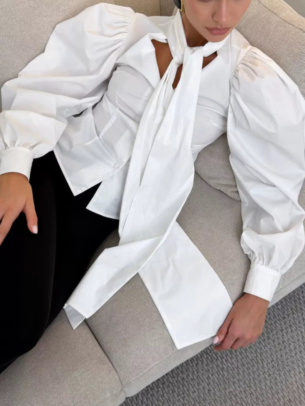 White blouse with waist-length and button-front