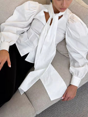 White blouse with waist-length and button-front