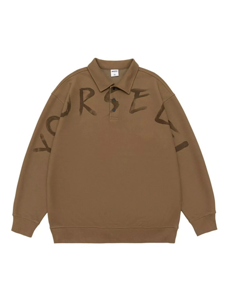 Oversized coffee polo sweatshirt with dark brown distressed letter print on front and sleeves.