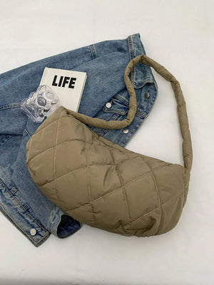 Khaki quilted crossbody bag with a puffy design and a single strap.