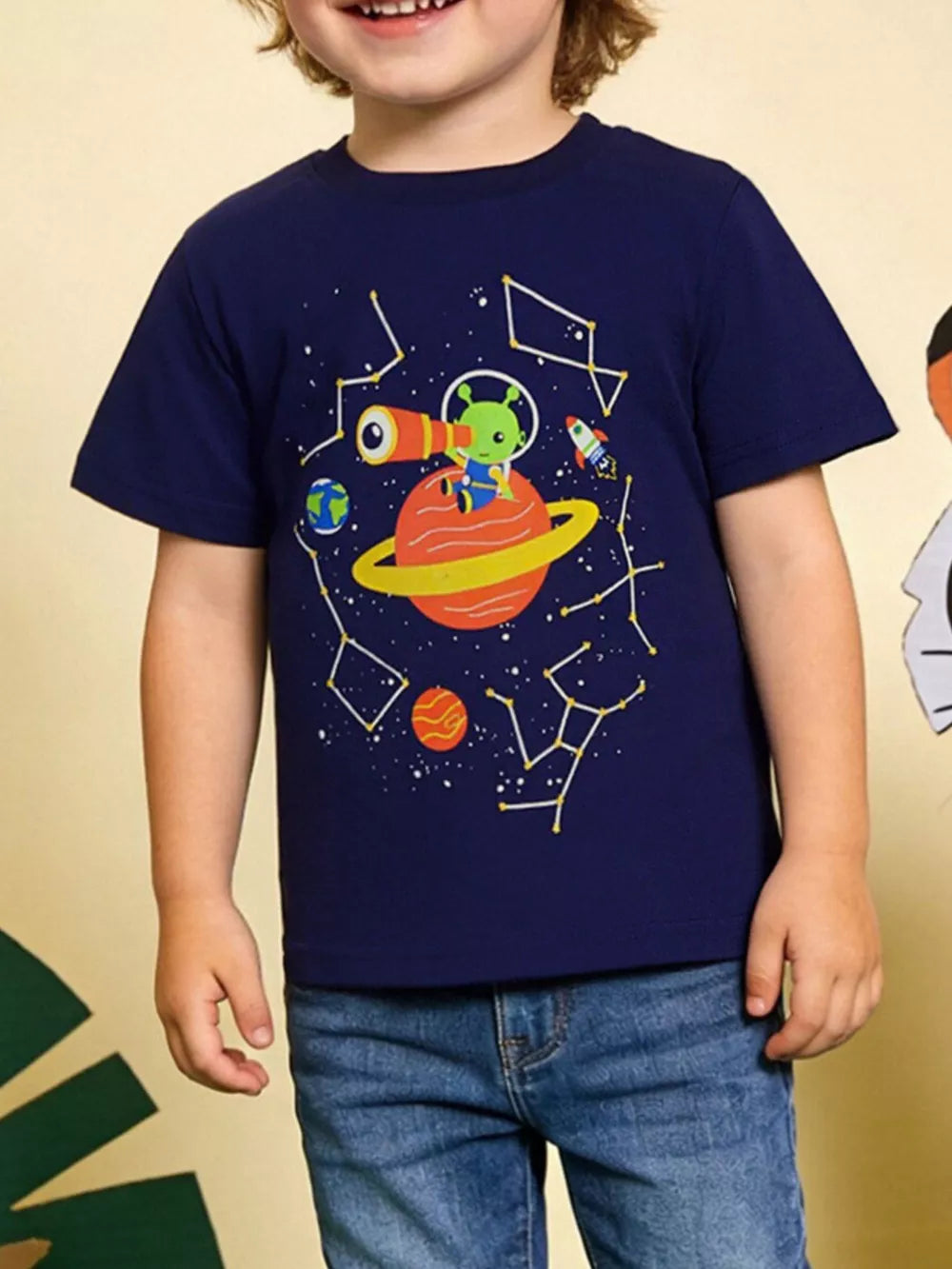 Navy cotton t-shirt with cosmic adventure graphic featuring an alien, planet, and rocket.