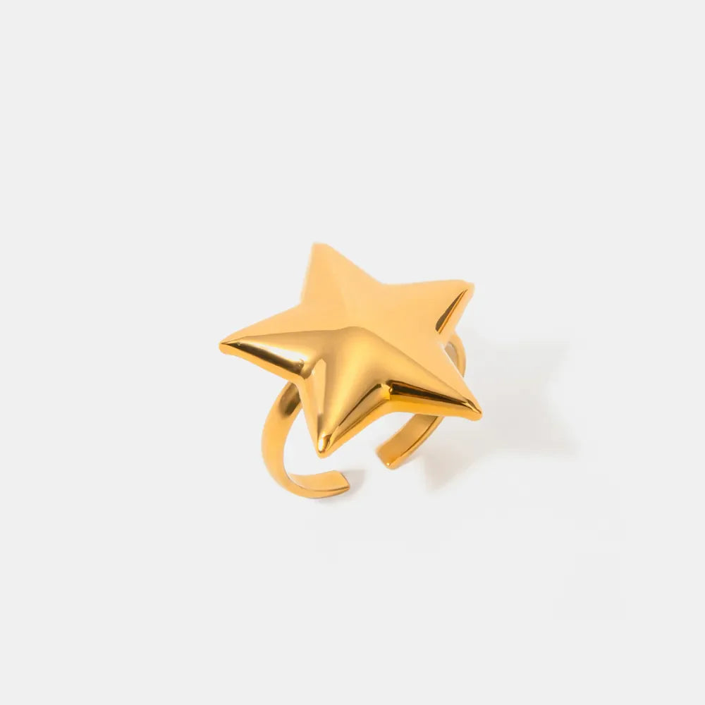 Gold starburst adjustable ring with bold, sculpted design.