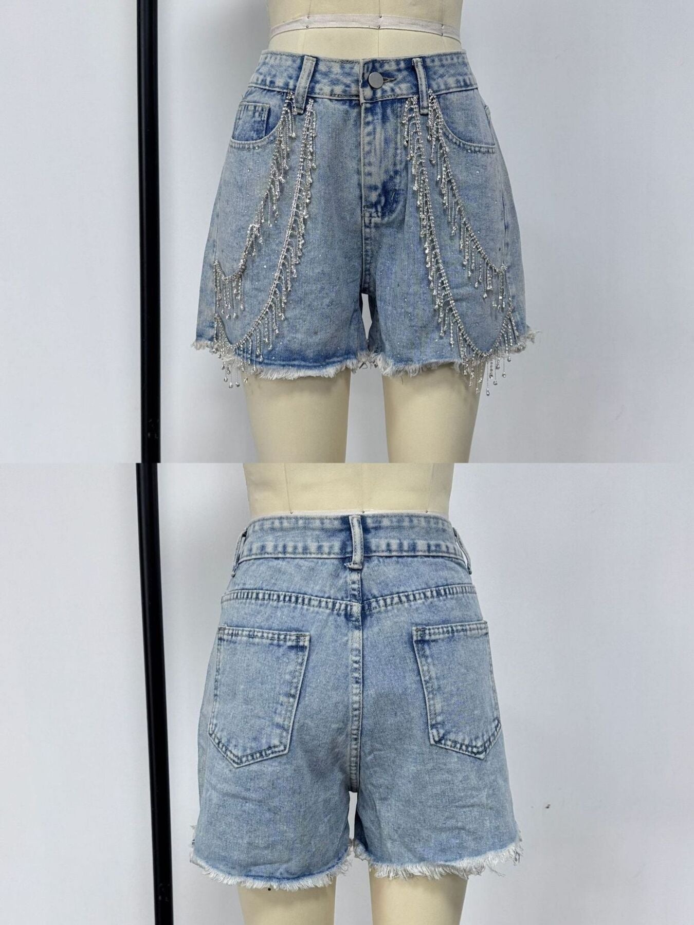 Sky blue denim shorts with rhinestone chain embellishments and frayed hem.