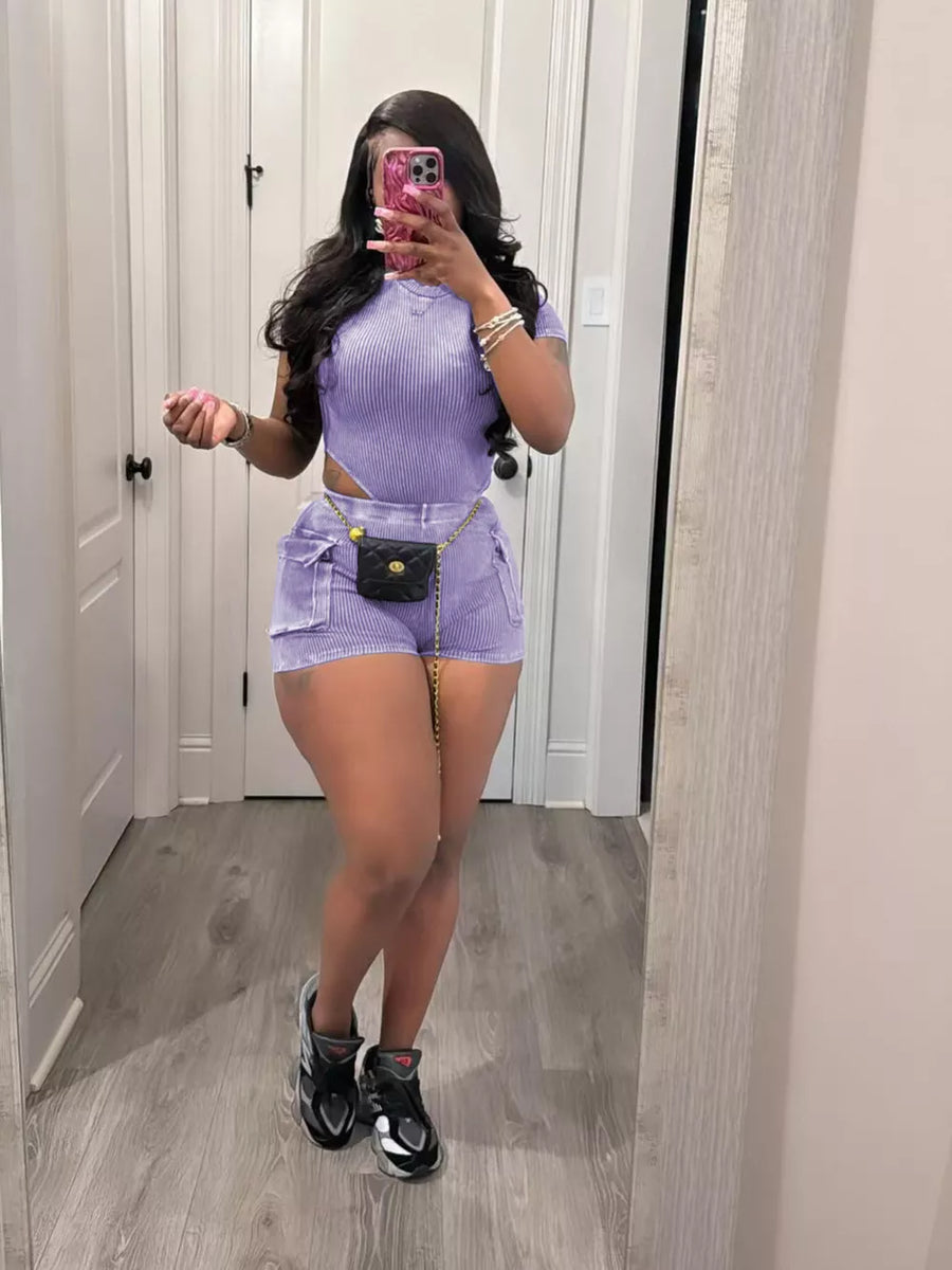 Purple ribbed crop top and shorts set with pockets and a chain belt.