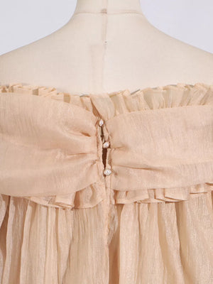 Champagne off-shoulder ruffled maternity blouse with pearl button detail