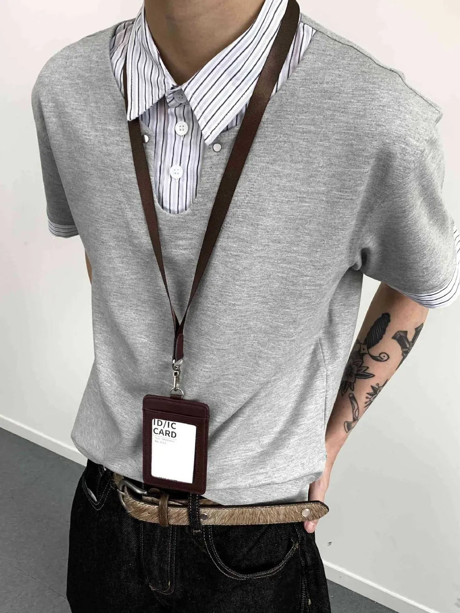 Gray layered polo with striped collar and button placket, cotton blend.