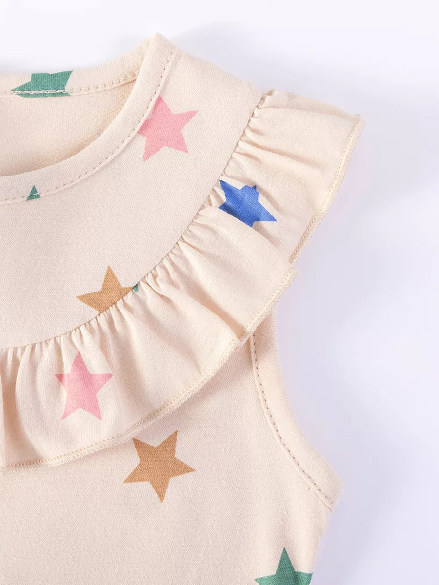 Beige cotton toddler dress with colorful star print and ruffled neckline.