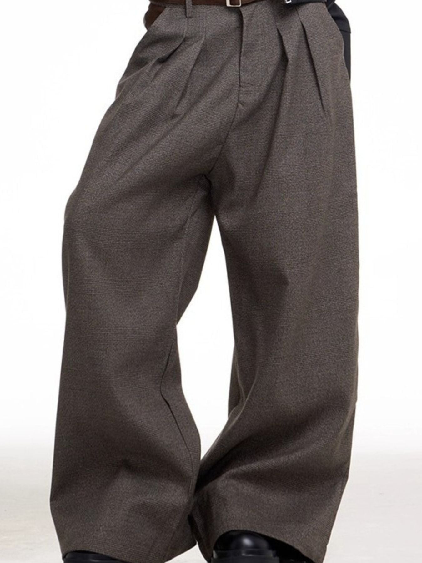 Plus size brown wide leg sweatpants with a high waist and pleats.
