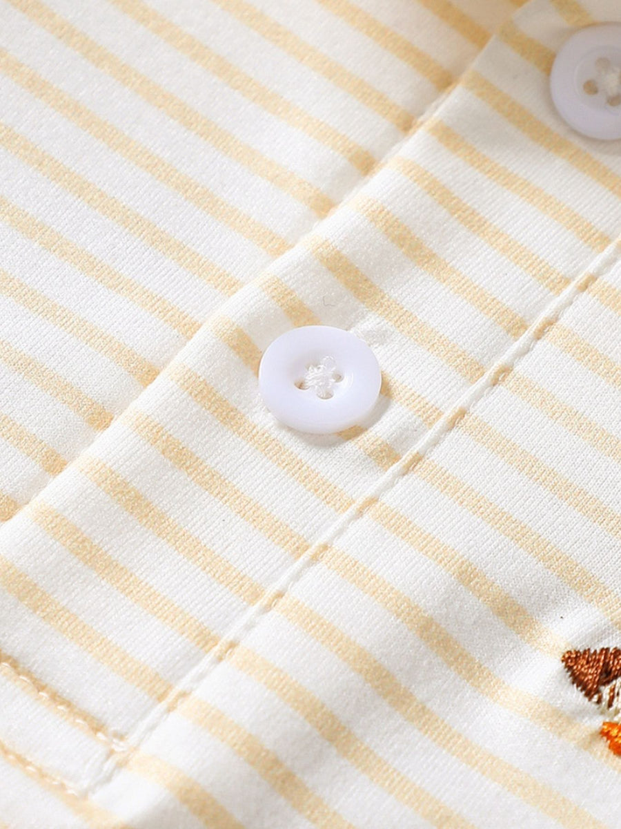 Light yellow striped cotton polo shirt for baby with embroidered duck detail.