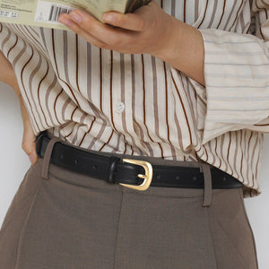 Black leather belt with gold buckle and adjustable strap