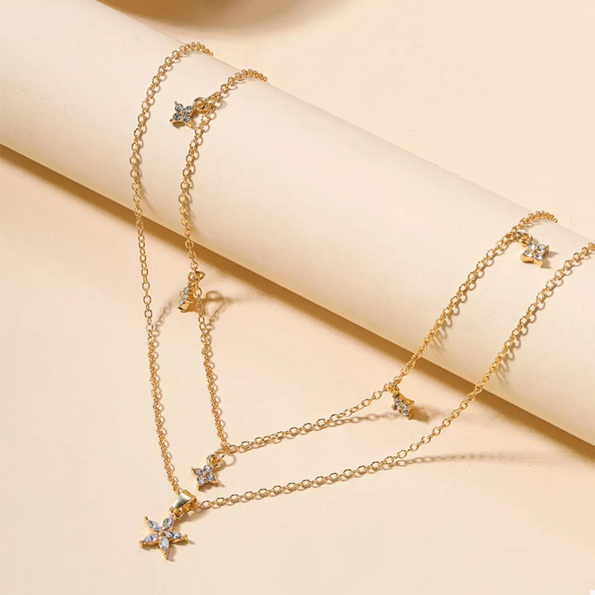 Gold double layer pendant necklace with crystal star charms