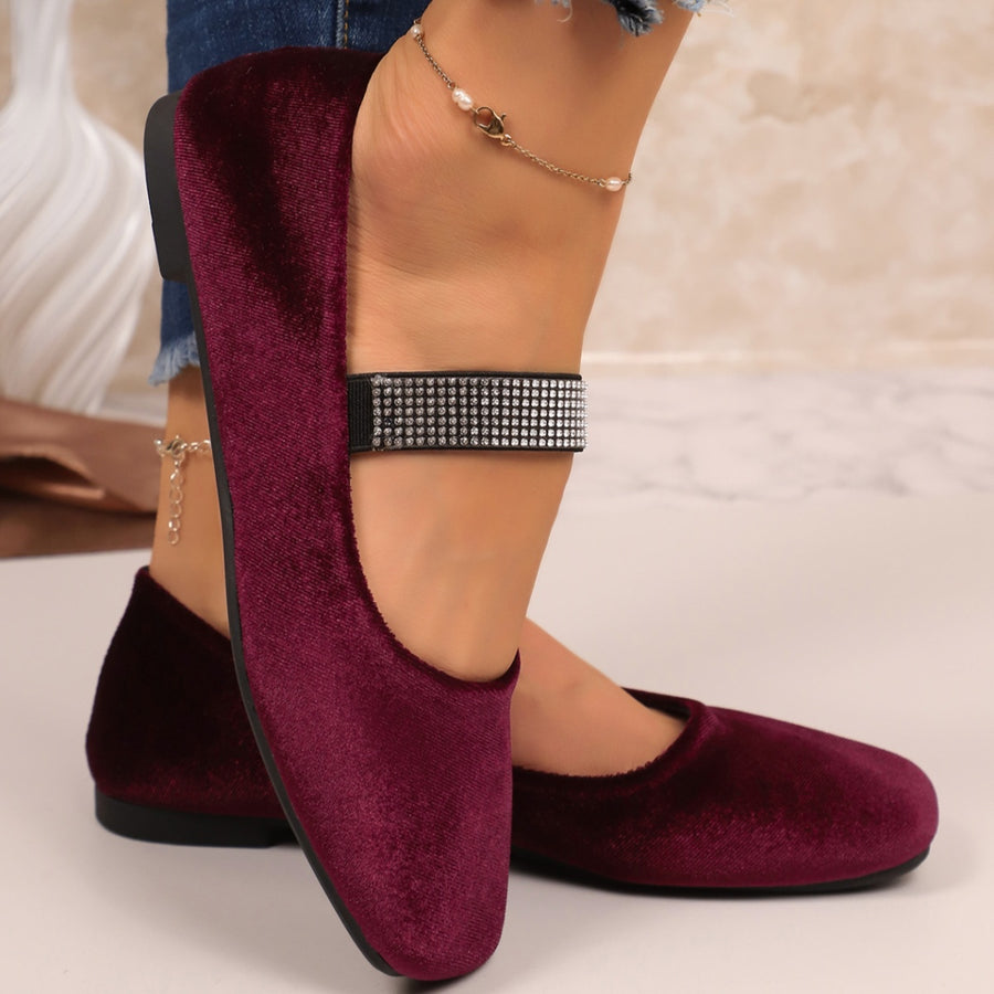 Velvet slip-on flats with embellished strap detail and square toe.