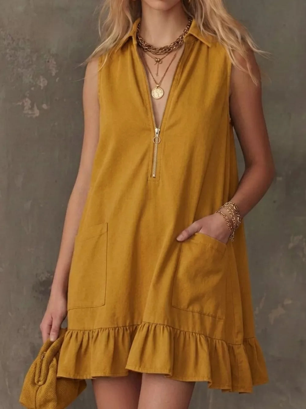 Mustard zip-front collared dress with ruffle hem and pockets.