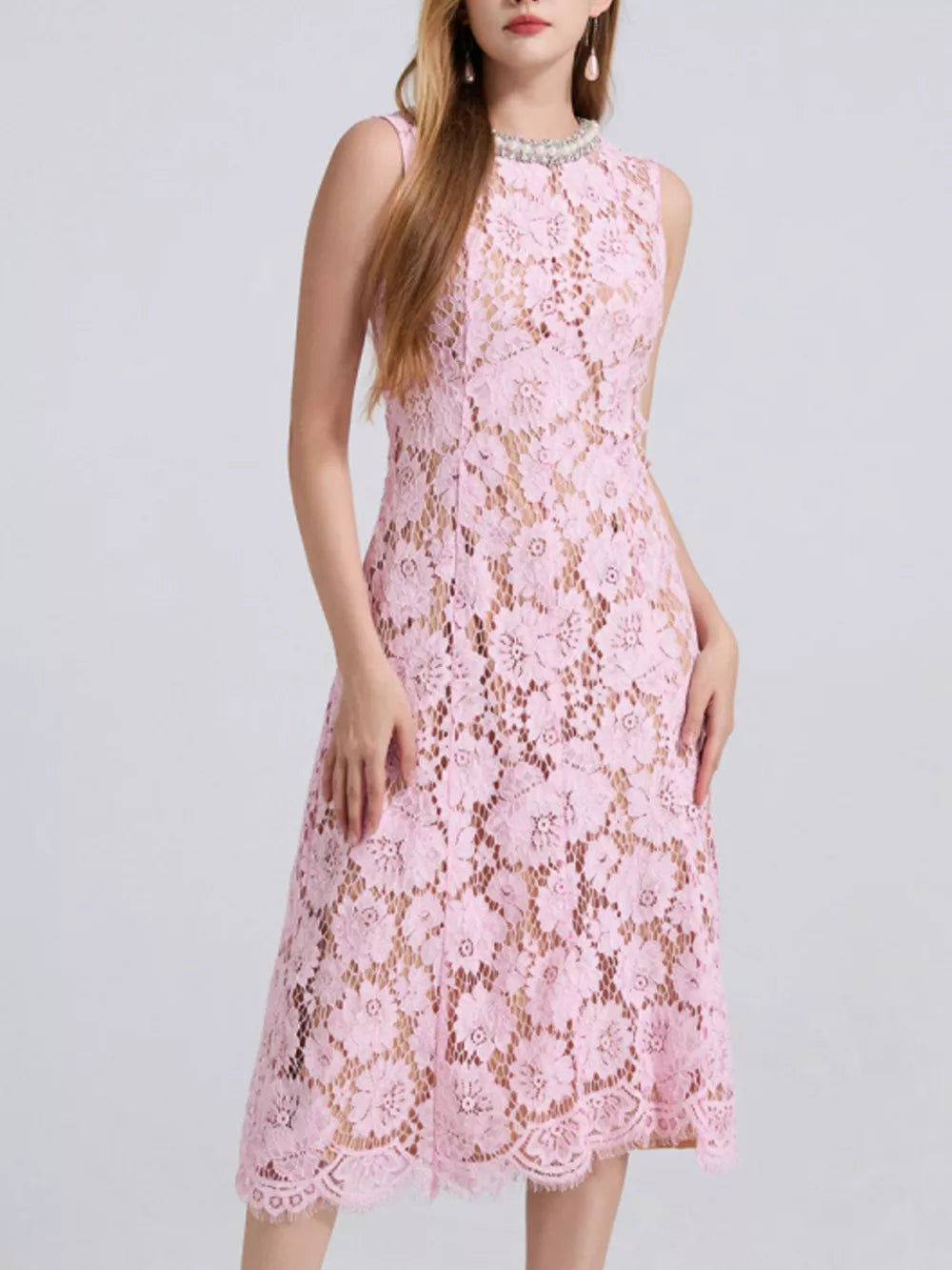 Pink lace dress with floral pattern, embellished neckline, and midi length.