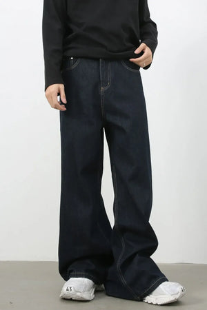 Exaggerated wide leg dark wash denim jeans with contrast stitching.