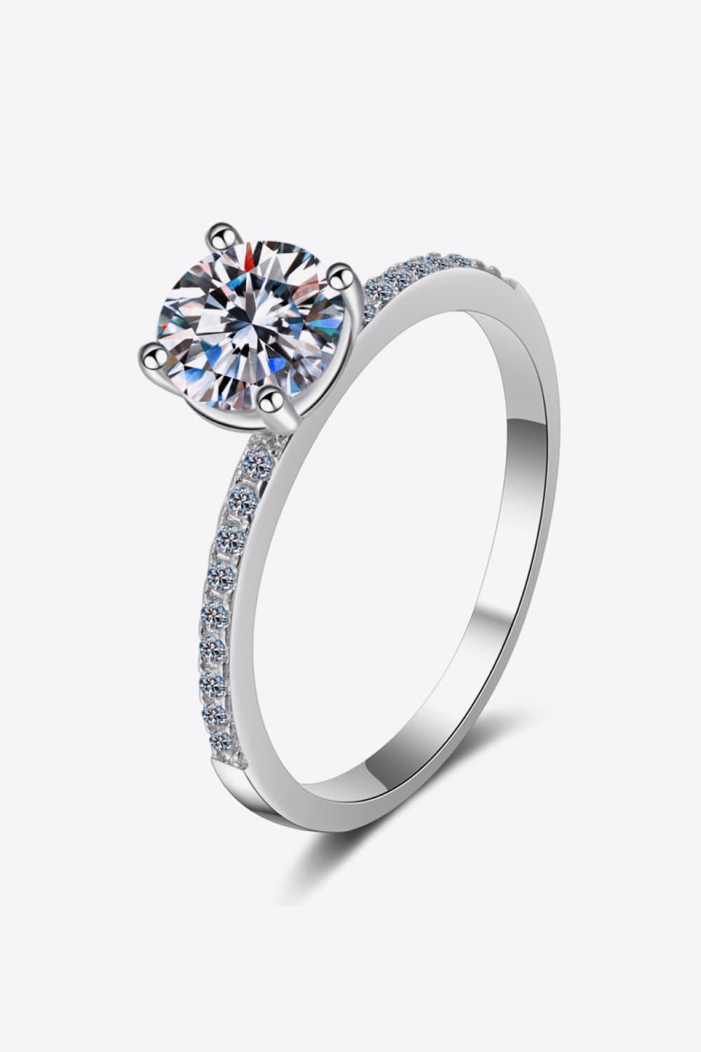 Sparkling moissanite ring in silver with pave diamond band.
